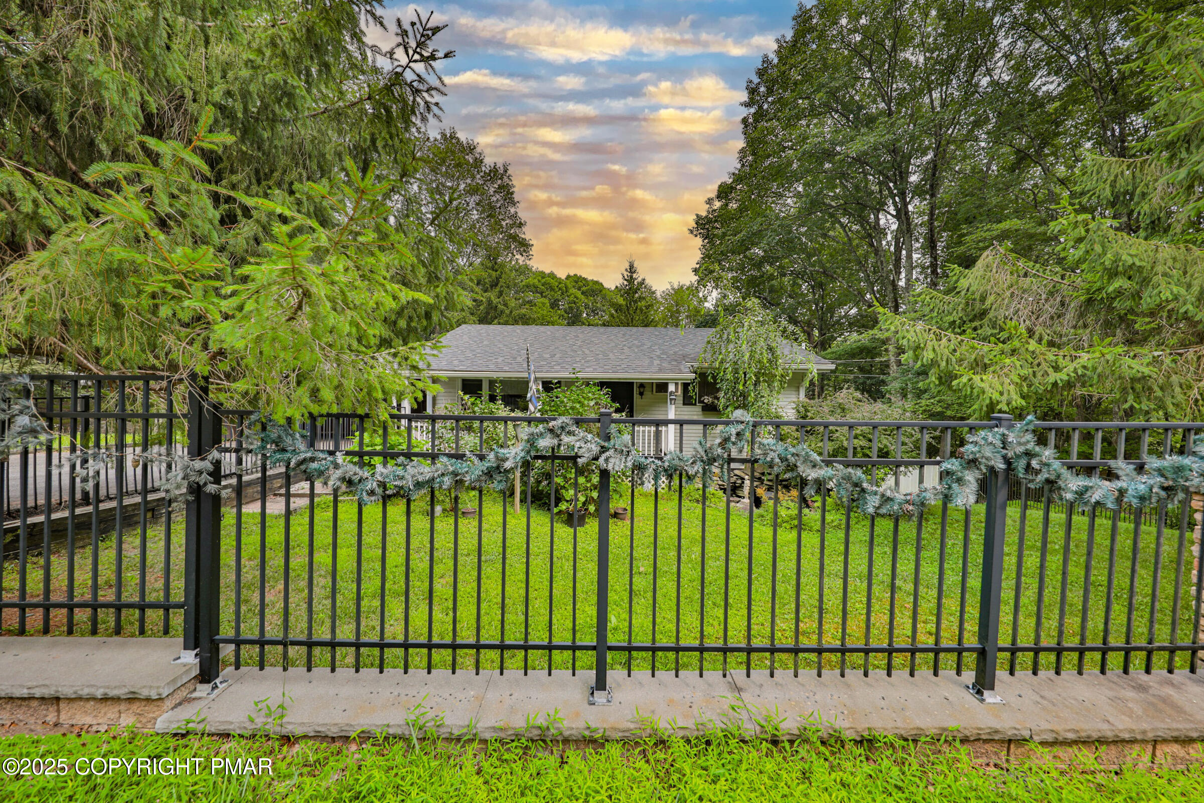 1094 Maple Lake Drive Bushkill, PA 18324 - Photo 15 of 81 a view of a swimming pool and a garden