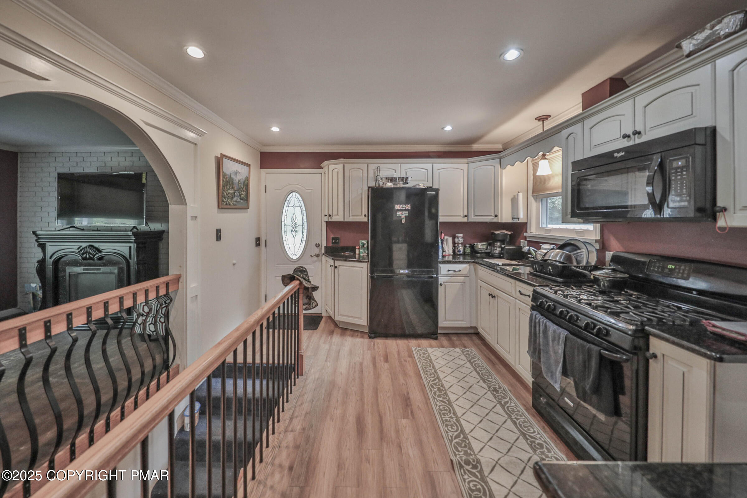 1094 Maple Lake Drive Bushkill, PA 18324 - Photo 19 of 81 a kitchen with stainless steel appliances granite countertop a refrigerator a stove top oven a sink and dishwasher
