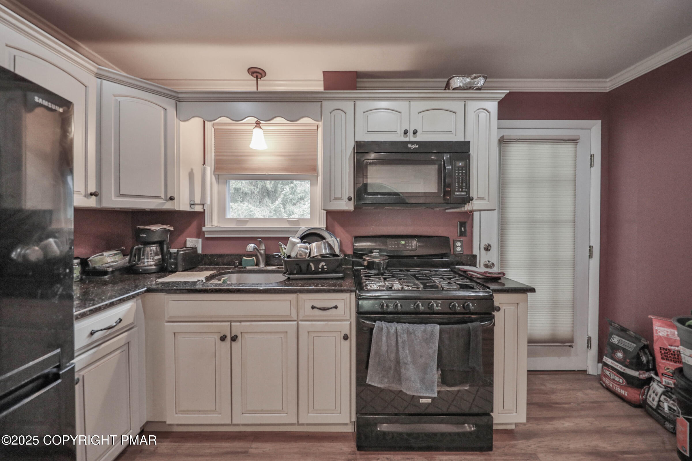 1094 Maple Lake Drive Bushkill, PA 18324 - Photo 24 of 81 a kitchen with granite countertop a stove sink and cabinets