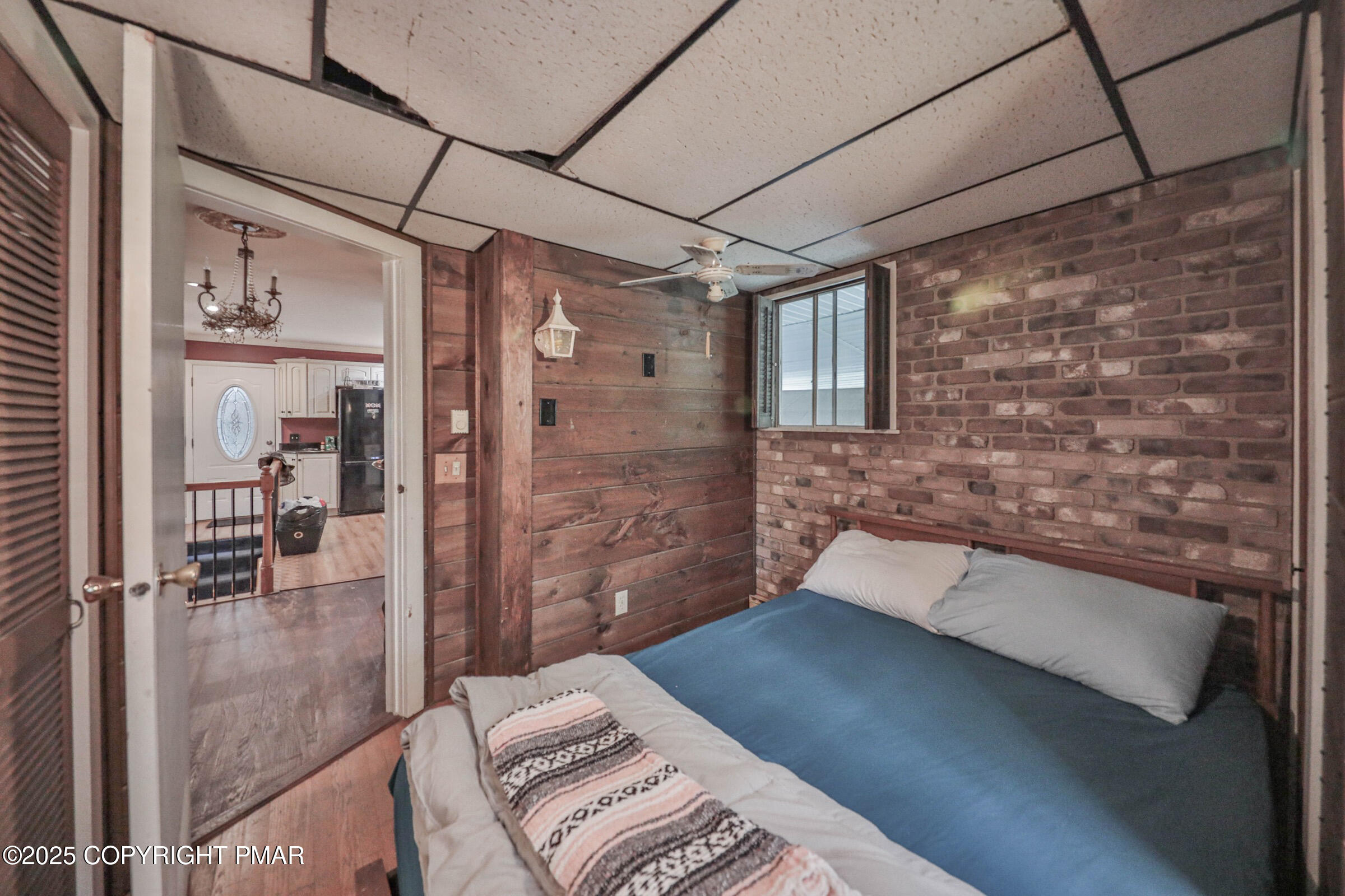 1094 Maple Lake Drive Bushkill, PA 18324 - Photo 37 of 81 a bedroom with a bed and a glass door