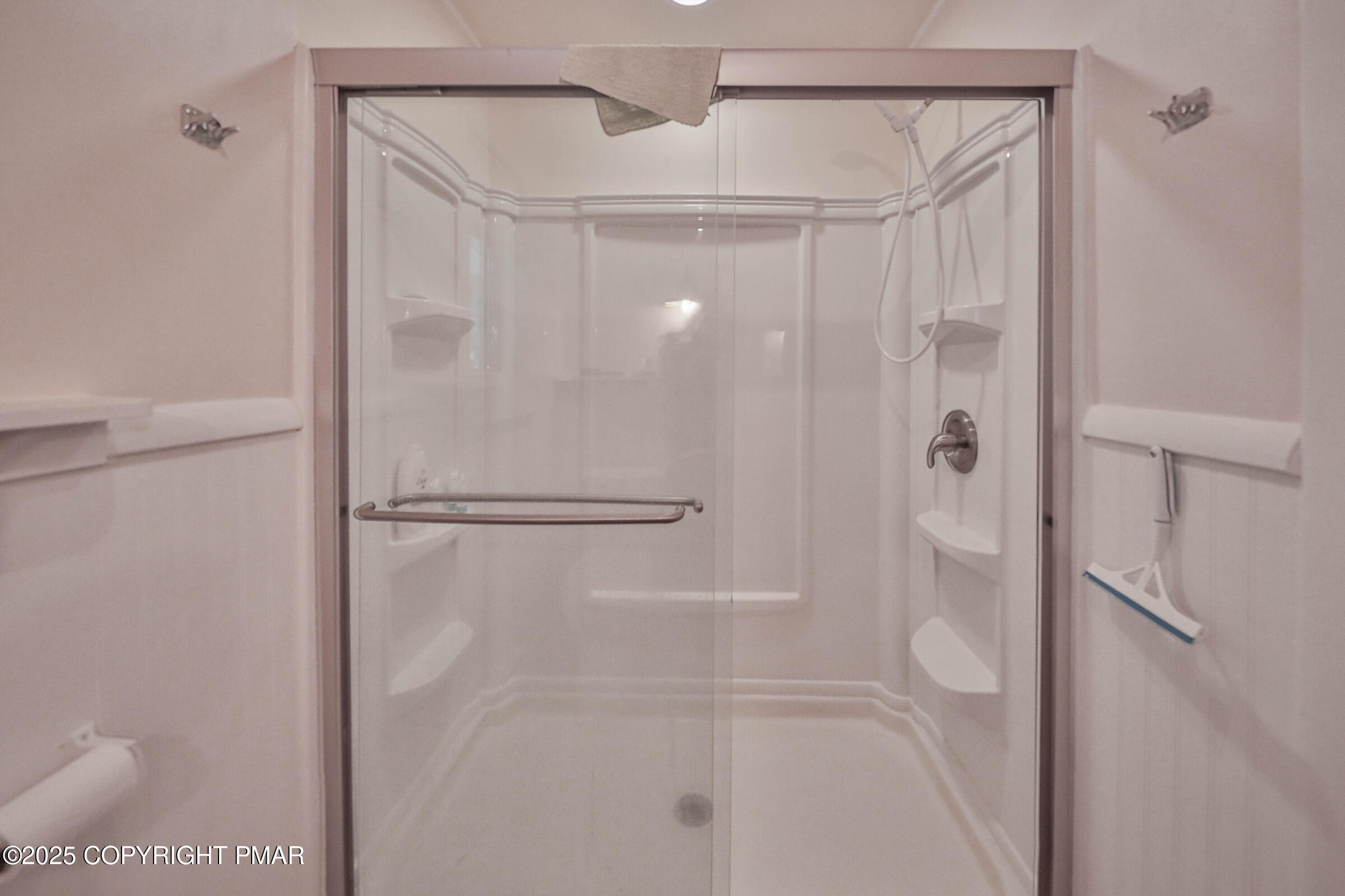 1094 Maple Lake Drive Bushkill, PA 18324 - Photo 39 of 81 a bathroom with a glass shower door