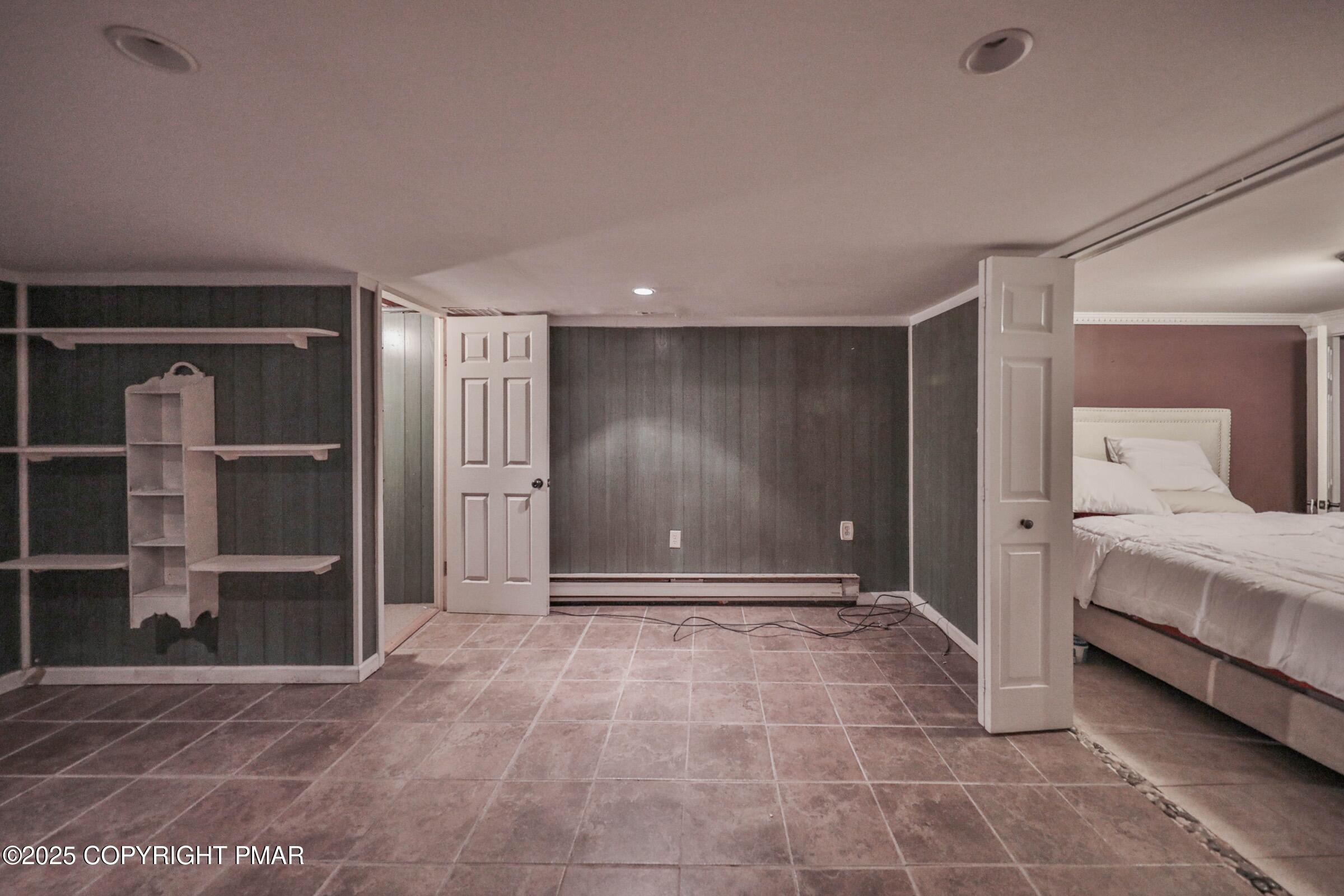 1094 Maple Lake Drive Bushkill, PA 18324 - Photo 43 of 81 a view of a room with shelves