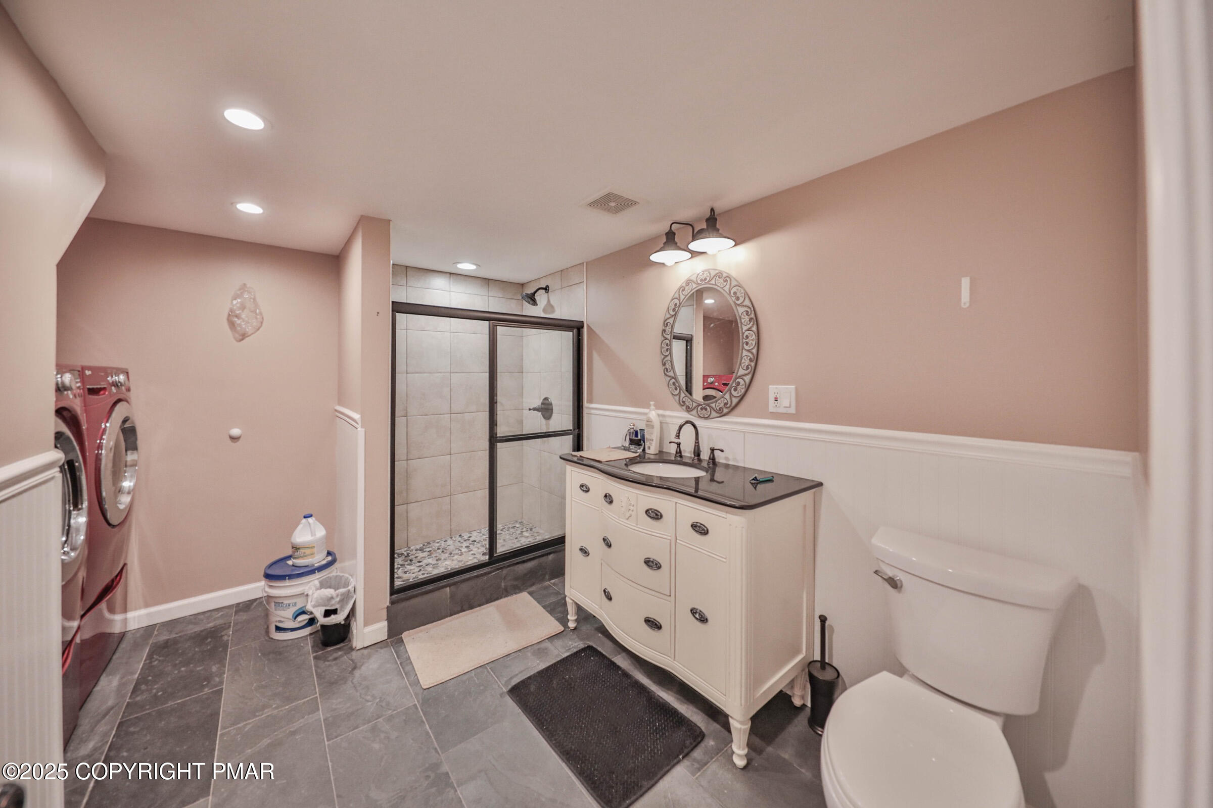 1094 Maple Lake Drive Bushkill, PA 18324 - Photo 53 of 81 a bathroom with a toilet a sink and mirror