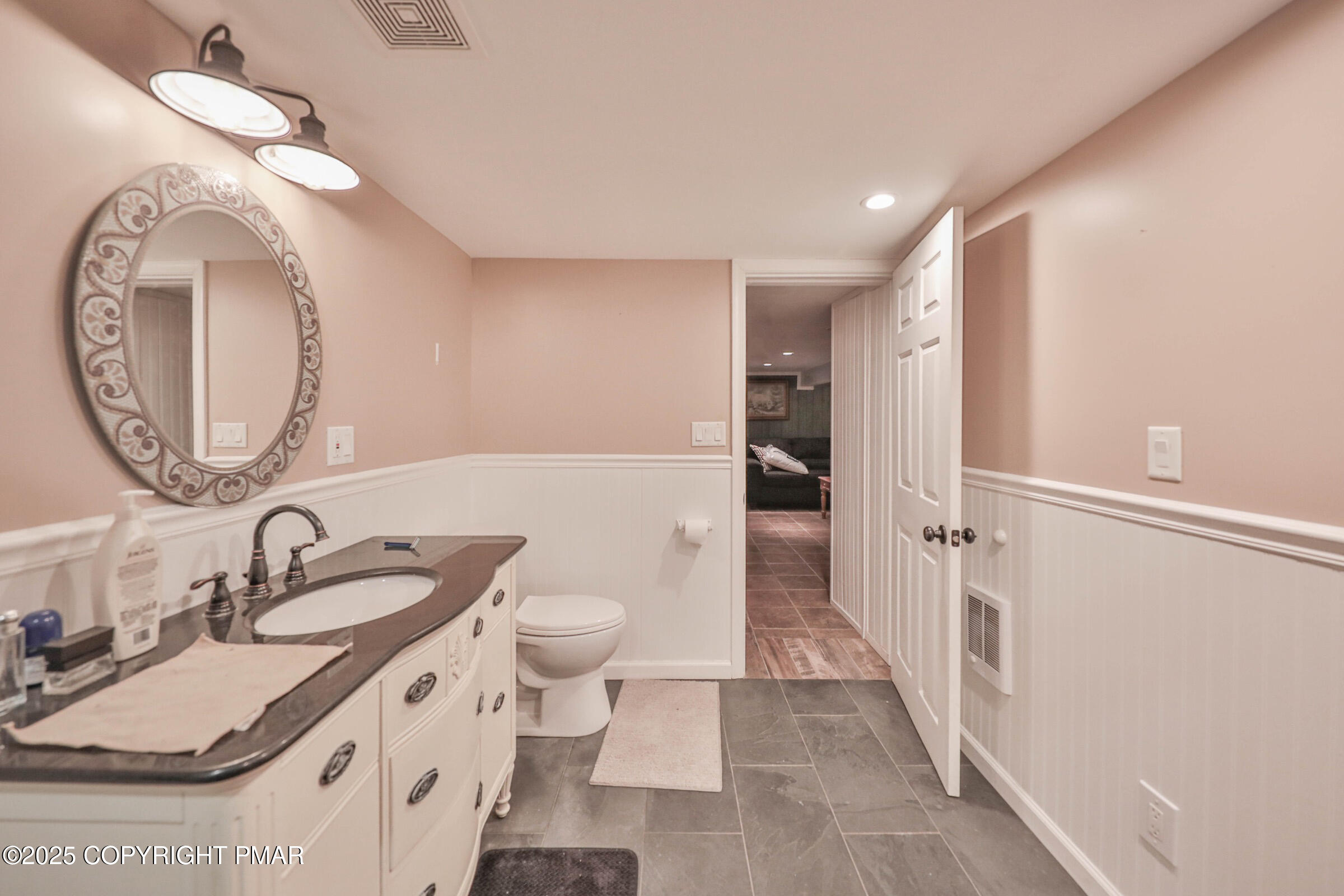 1094 Maple Lake Drive Bushkill, PA 18324 - Photo 55 of 81 a bathroom with a sink and a mirror