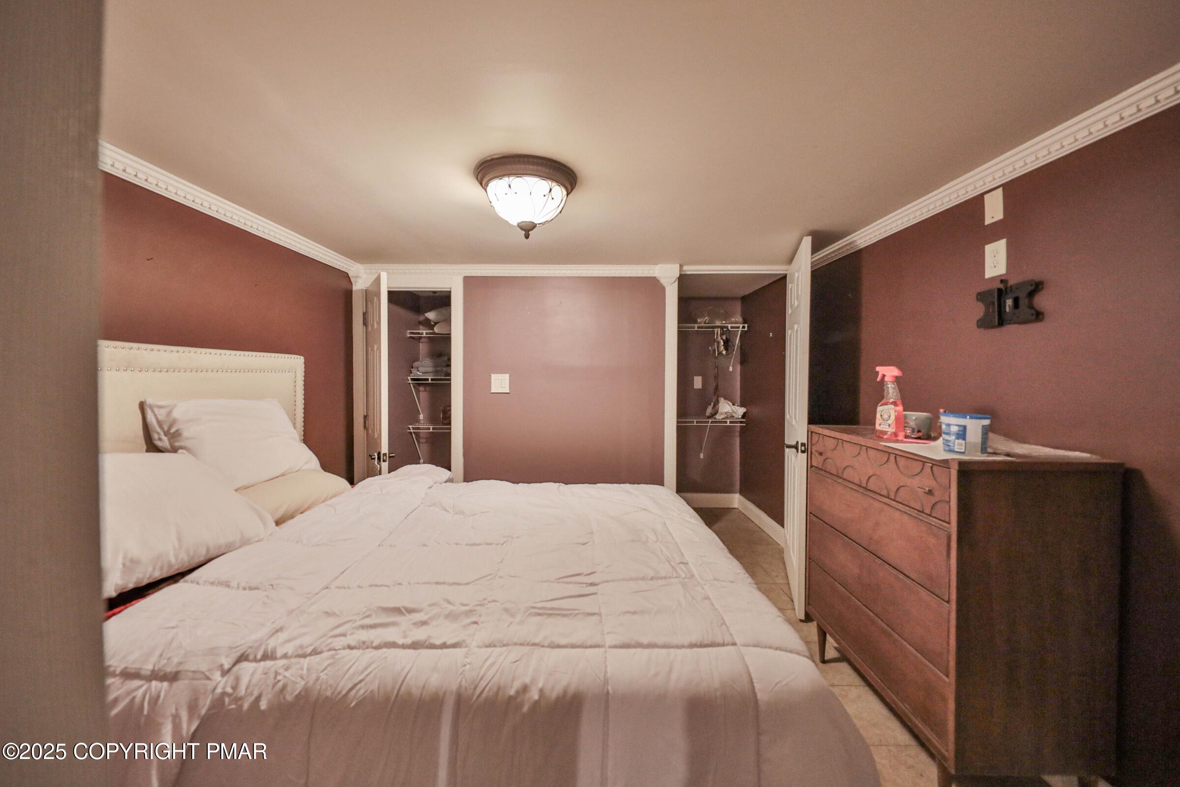 1094 Maple Lake Drive Bushkill, PA 18324 - Photo 59 of 81 a large white bed in a white room