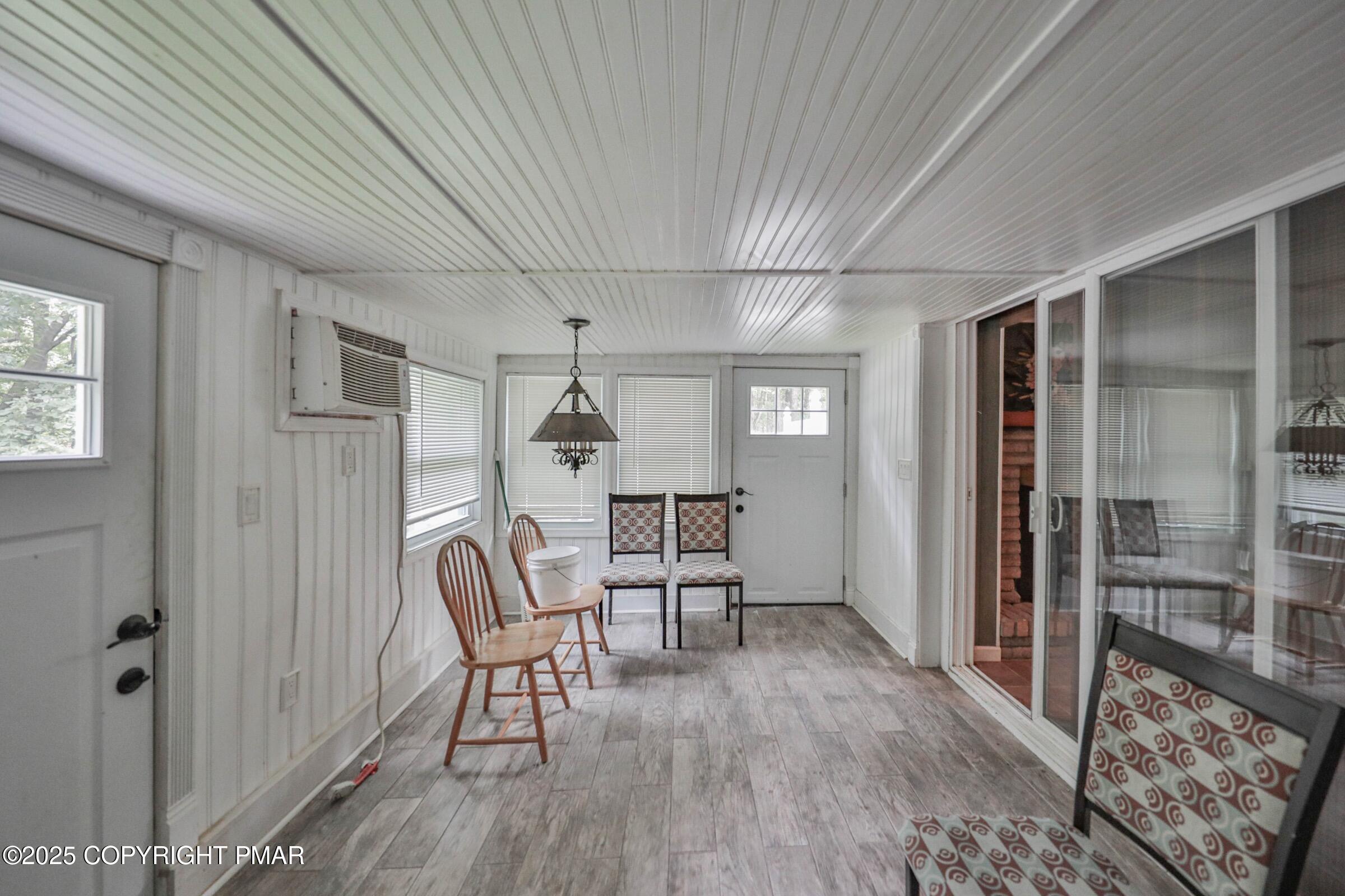 1094 Maple Lake Drive Bushkill, PA 18324 - Photo 64 of 81 a view of a livingroom with furniture wooden floor and window
