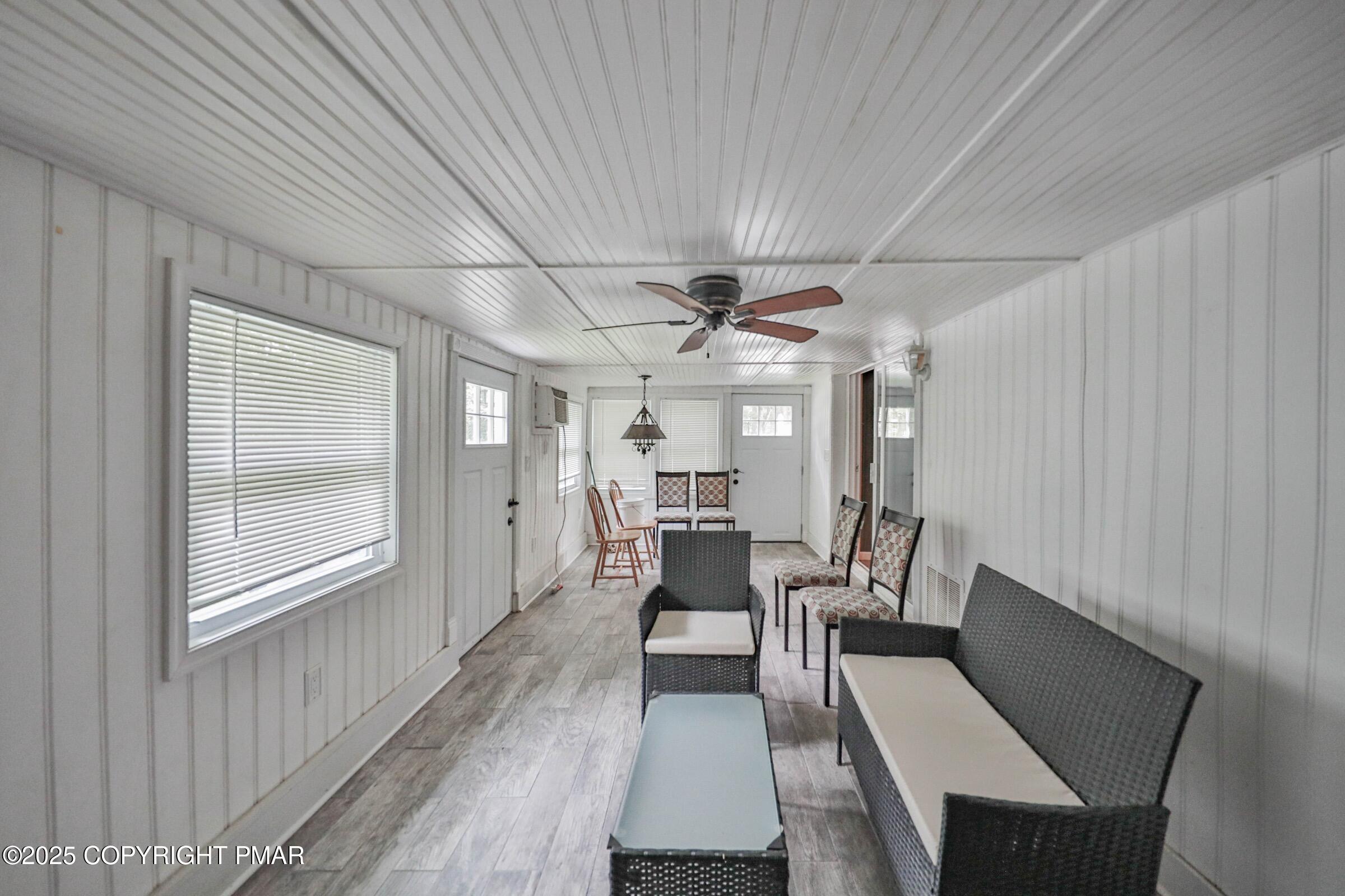 1094 Maple Lake Drive Bushkill, PA 18324 - Photo 65 of 81 a dining room with furniture and wooden floor