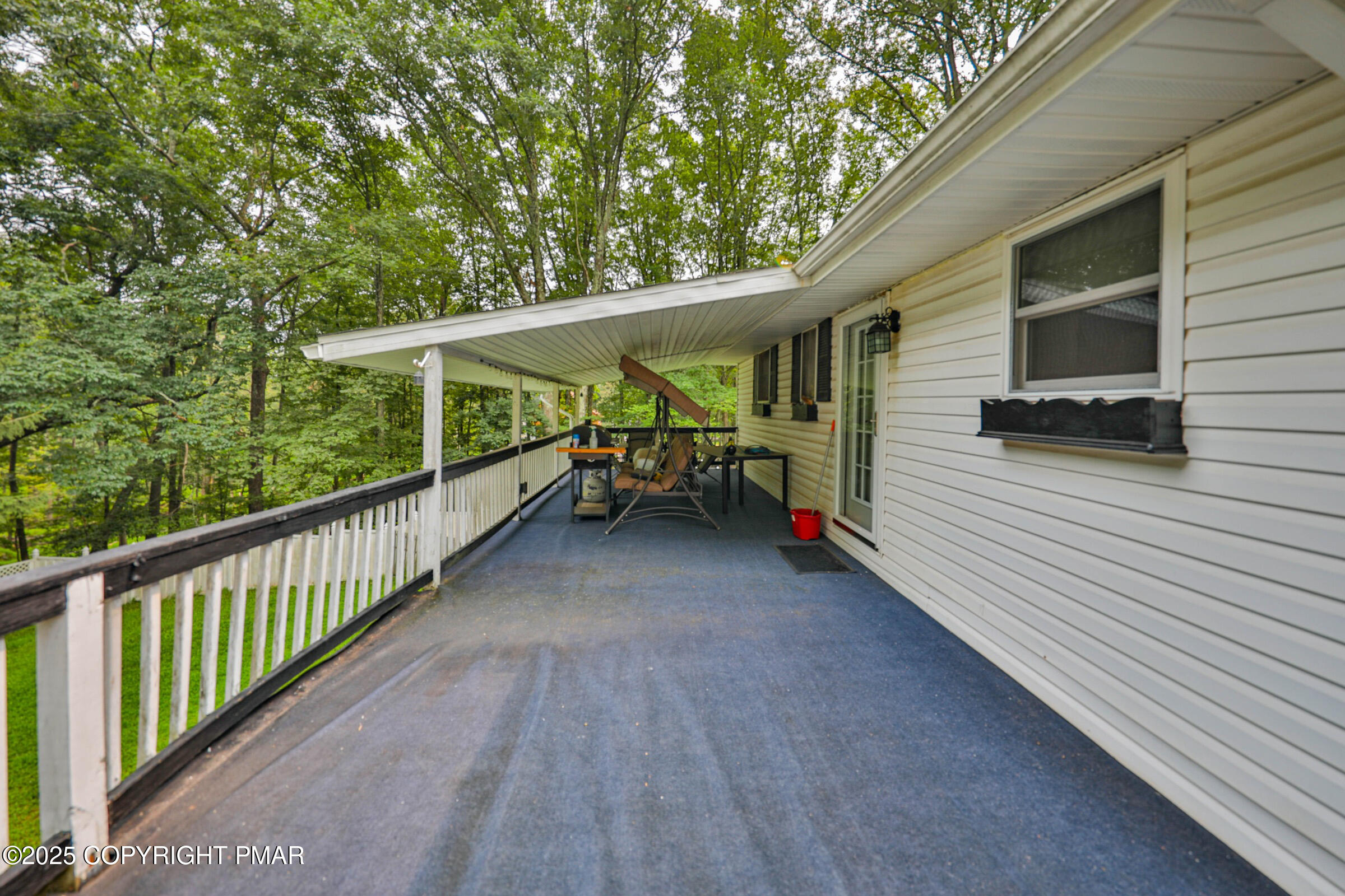 1094 Maple Lake Drive Bushkill, PA 18324 - Photo 79 of 81 a view of a porch with furniture and a yard