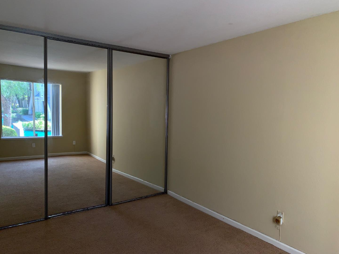 105 Reflections Drive, Unit 15 San Ramon, CA 94583 - Photo 18 of 42 a view of an empty room with a window