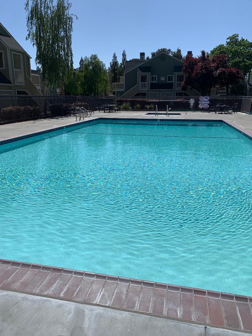 105 Reflections Drive, Unit 15 San Ramon, CA 94583 - Photo 40 of 42 a view of a swimming pool and a yard
