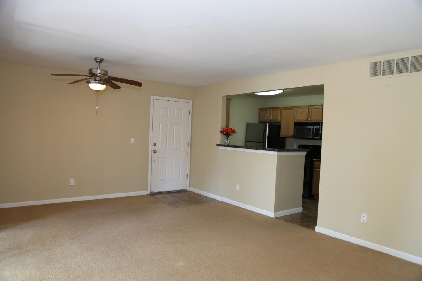 105 Reflections Drive, Unit 15 San Ramon, CA 94583 - Photo 10 of 42 a view of a room with a sink and a chandelier fan
