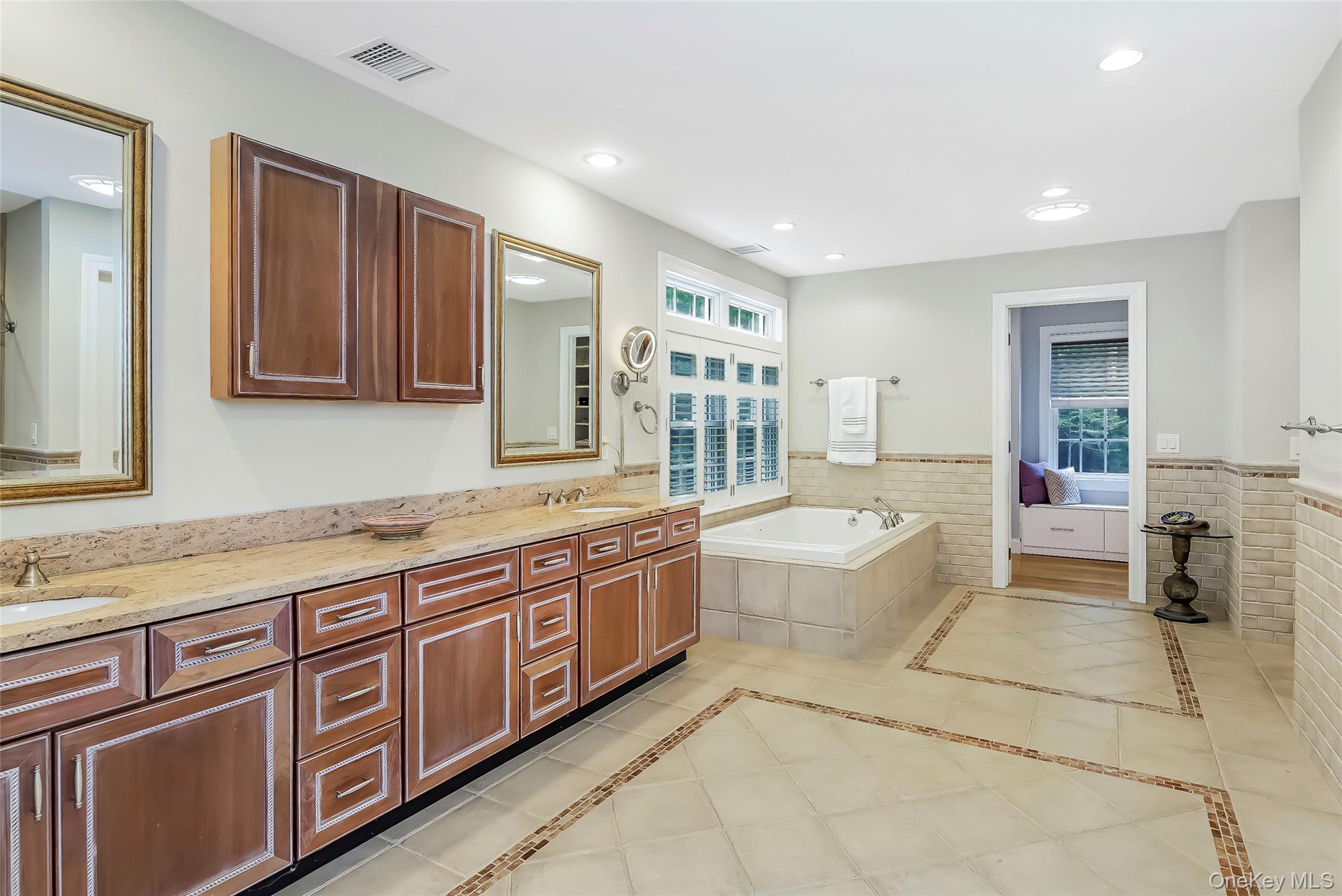 3 Sally's Path East Hampton, NY 11937 - Photo 16 of 30 a bathroom with a tub sink and mirror