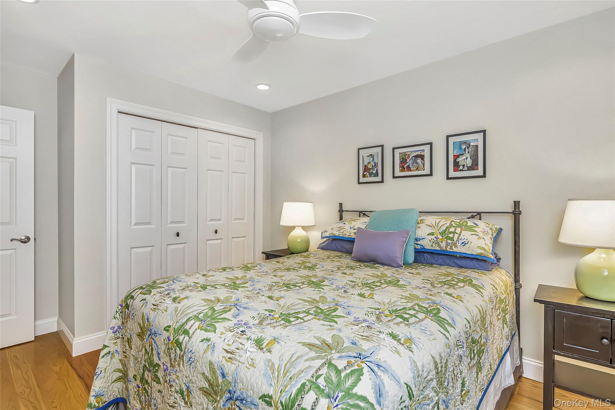 3 Sally's Path East Hampton, NY 11937 - Photo 23 of 30 a bedroom with a large bed and a chandelier