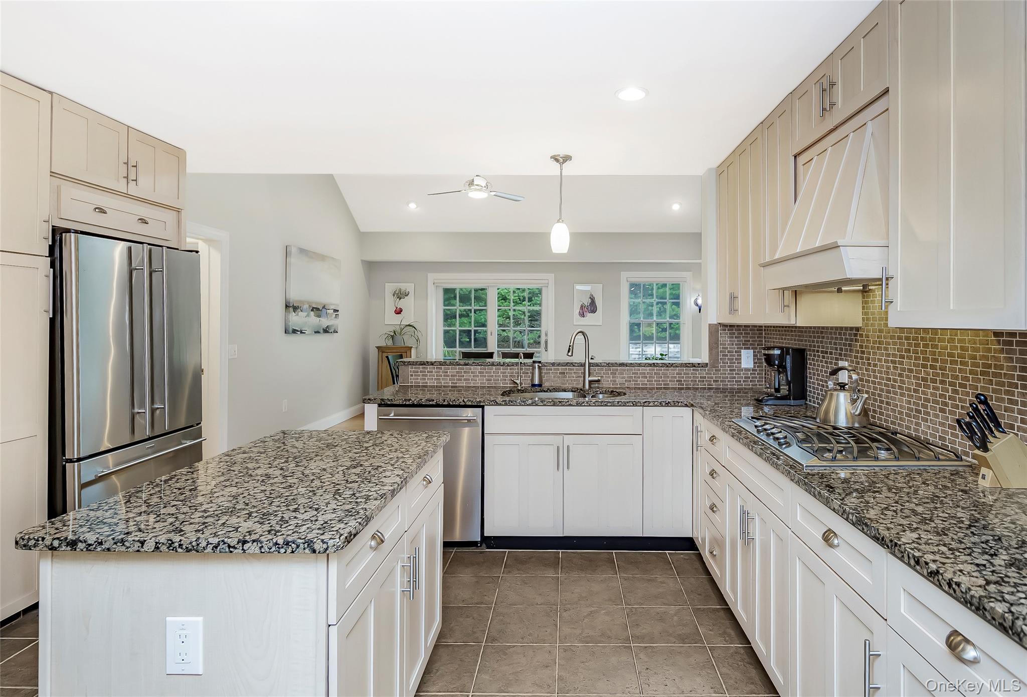 3 Sally's Path East Hampton, NY 11937 - Photo 8 of 30 a kitchen with stainless steel appliances granite countertop a sink stove and refrigerator