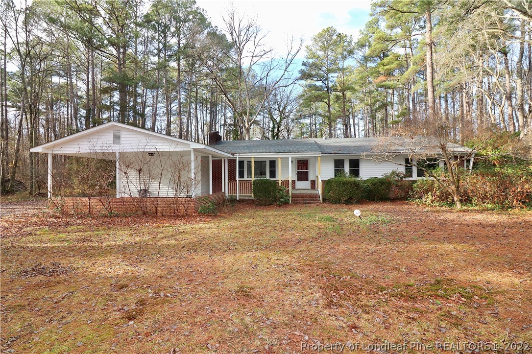 564 Shady Lane Road Carthage, NC 28327 - Photo 1 of 21 a house that has a tree in it