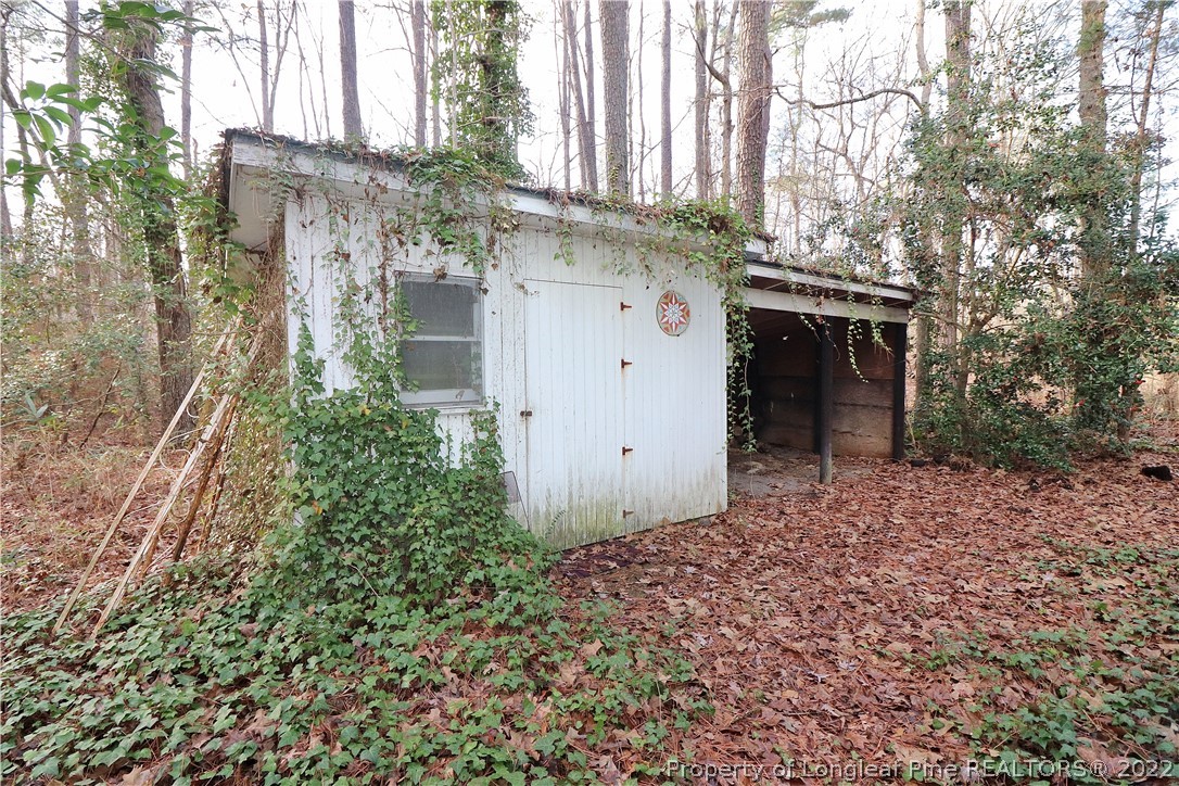 564 Shady Lane Road Carthage, NC 28327 - Photo 19 of 21 a view of a house with a yard and garage