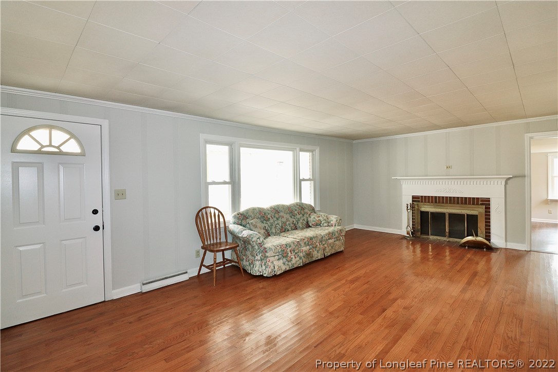 564 Shady Lane Road Carthage, NC 28327 - Photo 3 of 21 a living room with furniture and a fireplace