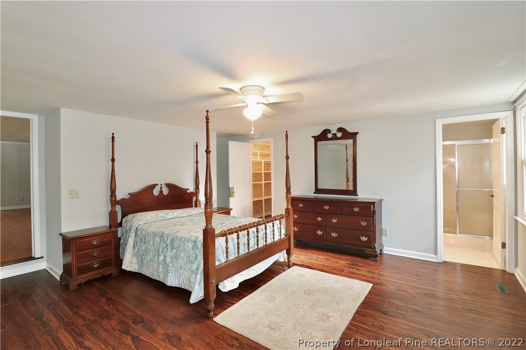 564 Shady Lane Road Carthage, NC 28327 - Photo 4 of 21 a bedroom with a bed and wooden floor