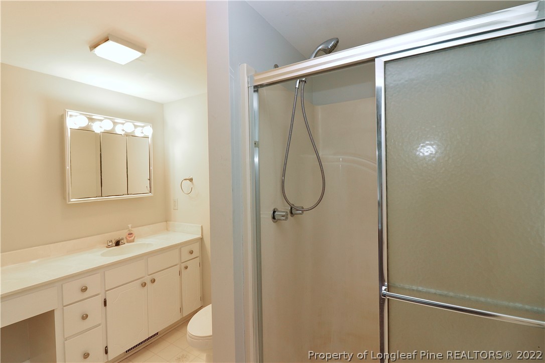 564 Shady Lane Road Carthage, NC 28327 - Photo 6 of 21 a bathroom with a shower sink and mirror