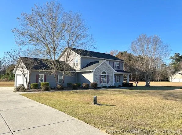 a front view of a house with a yard