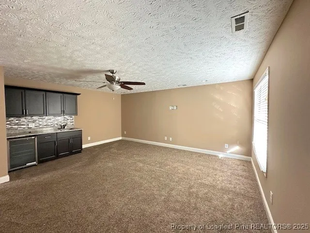 a view of a room with cabinet and mirrors