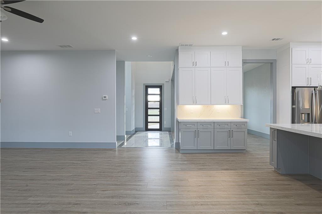 1341 Wheeler Creek Road Maysville, GA 30558 - Photo 11 of 51 a view of kitchen and hall with wooden floor