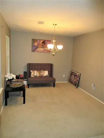 a bedroom with furniture and a fireplace