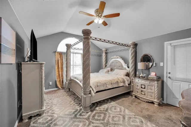 a bedroom with a bed next to a window with outer view