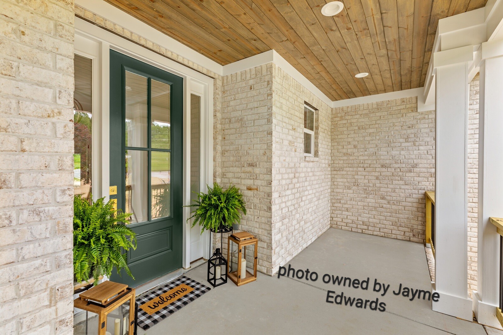 1235 Cliff Amos Road Spring Hill, TN 37174 - Photo 2 of 16 a potted plants sitting in front of a door