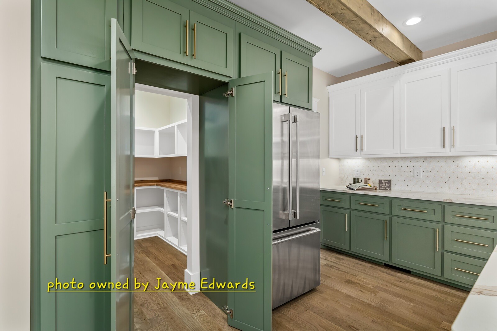 1235 Cliff Amos Road Spring Hill, TN 37174 - Photo 9 of 16 a kitchen with cabinets and a refrigerator