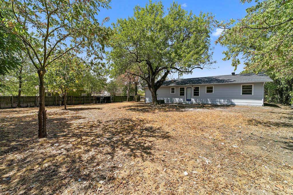 718 Frame Street Denton, TX 76209 - Photo 1 of 1 a house with trees in the background