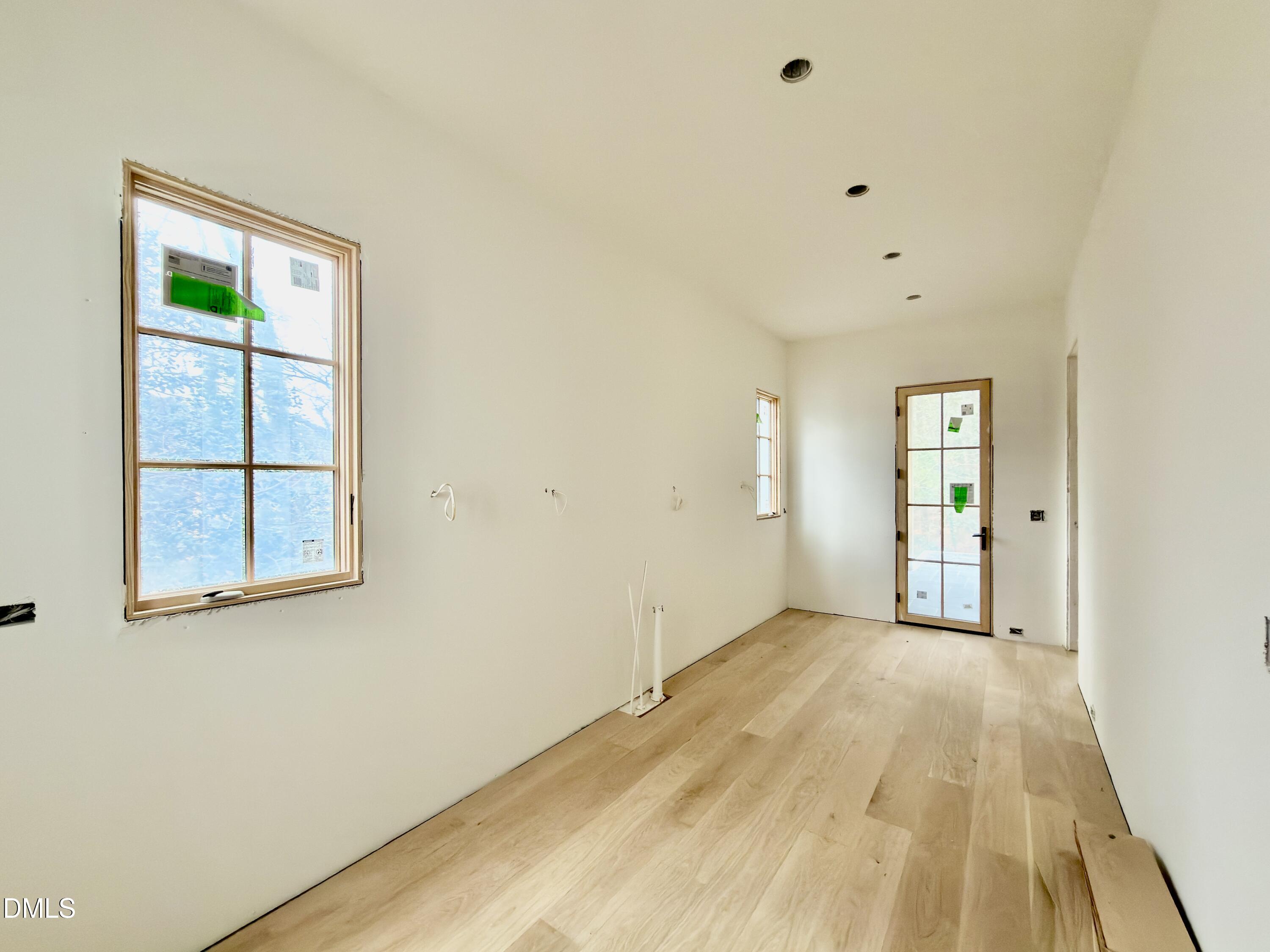 4801 Rampart Street Raleigh, NC 27609 - Photo 12 of 51 an empty room with windows