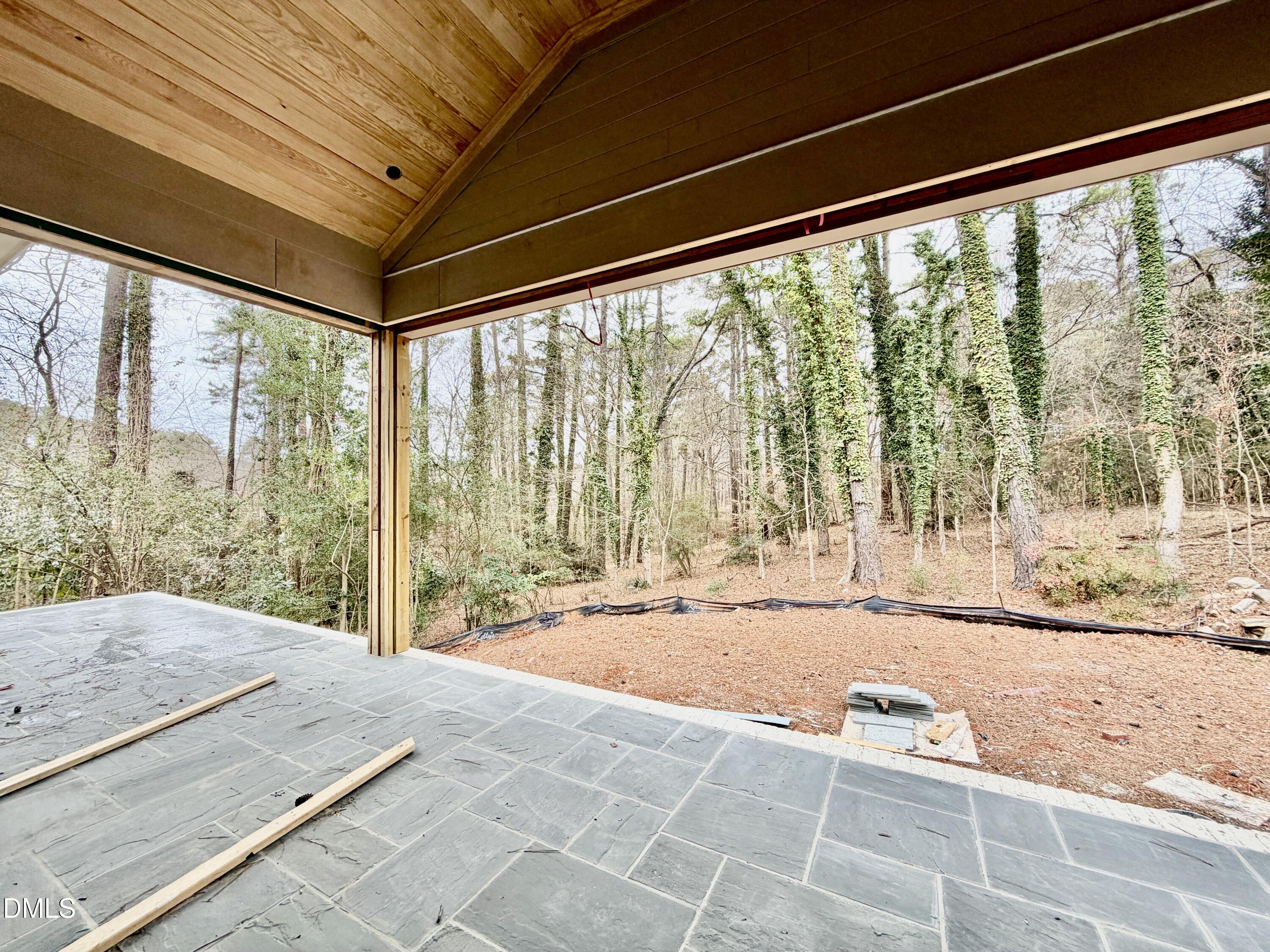 4801 Rampart Street Raleigh, NC 27609 - Photo 30 of 51 a spacious bedroom with a large window and a bed