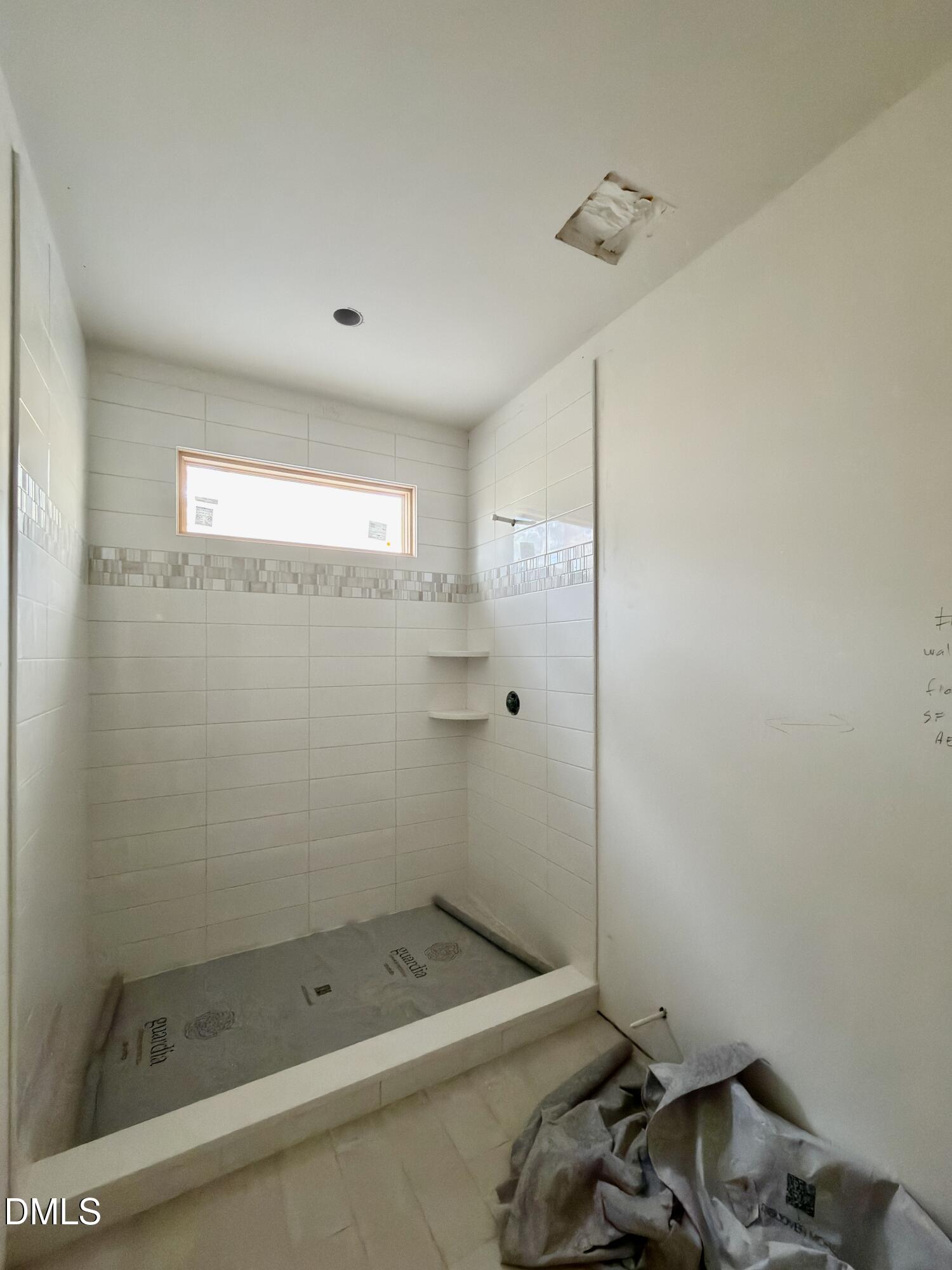 4801 Rampart Street Raleigh, NC 27609 - Photo 45 of 51 a bathroom with a bathtub and shower