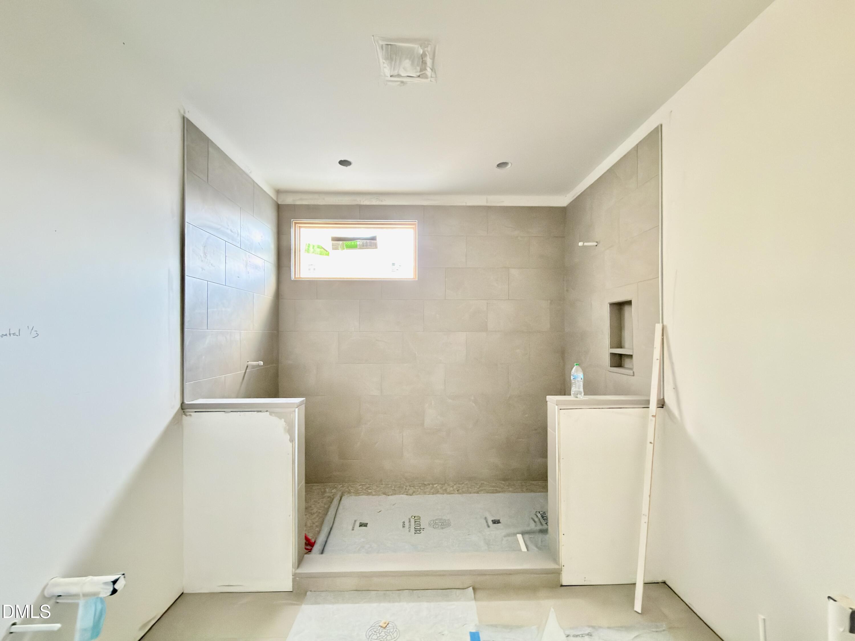 4801 Rampart Street Raleigh, NC 27609 - Photo 47 of 51 a bathroom with a sink and a mirror
