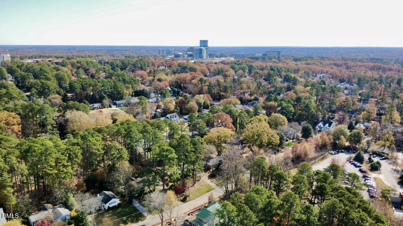 4801 Rampart Street Raleigh, NC 27609 - Photo 49 of 51 an aerial view of a house with a yard and lake view