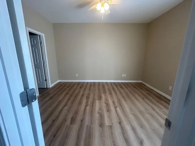 a view of wooden floor in an empty room