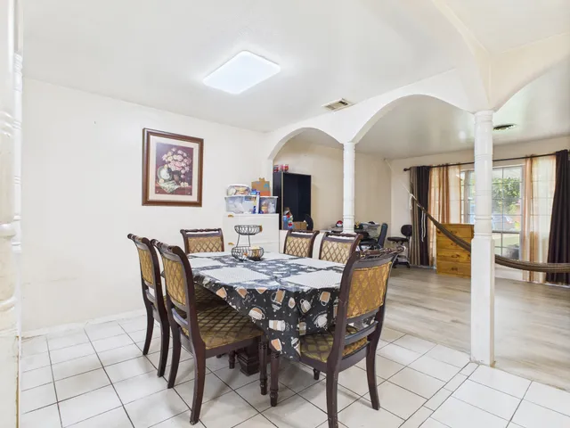 a view of a dining room with furniture