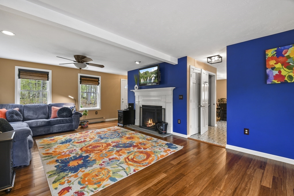 10 Sandy Cove Road Lunenburg, MA 01462 - Photo 11 of 43 a living room with furniture or couch and a fireplace