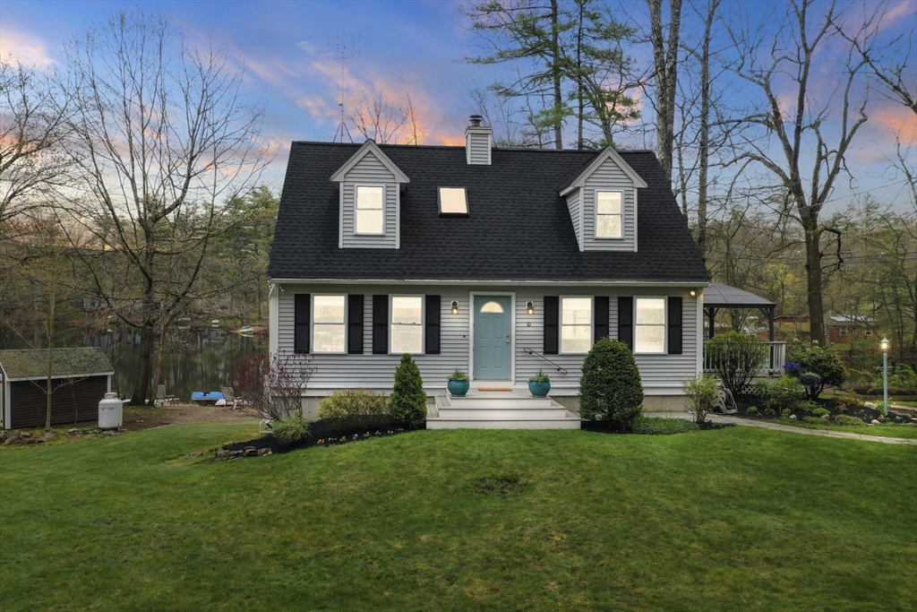 10 Sandy Cove Road Lunenburg, MA 01462 - Photo 42 of 43 a front view of a house with a yard table and chairs