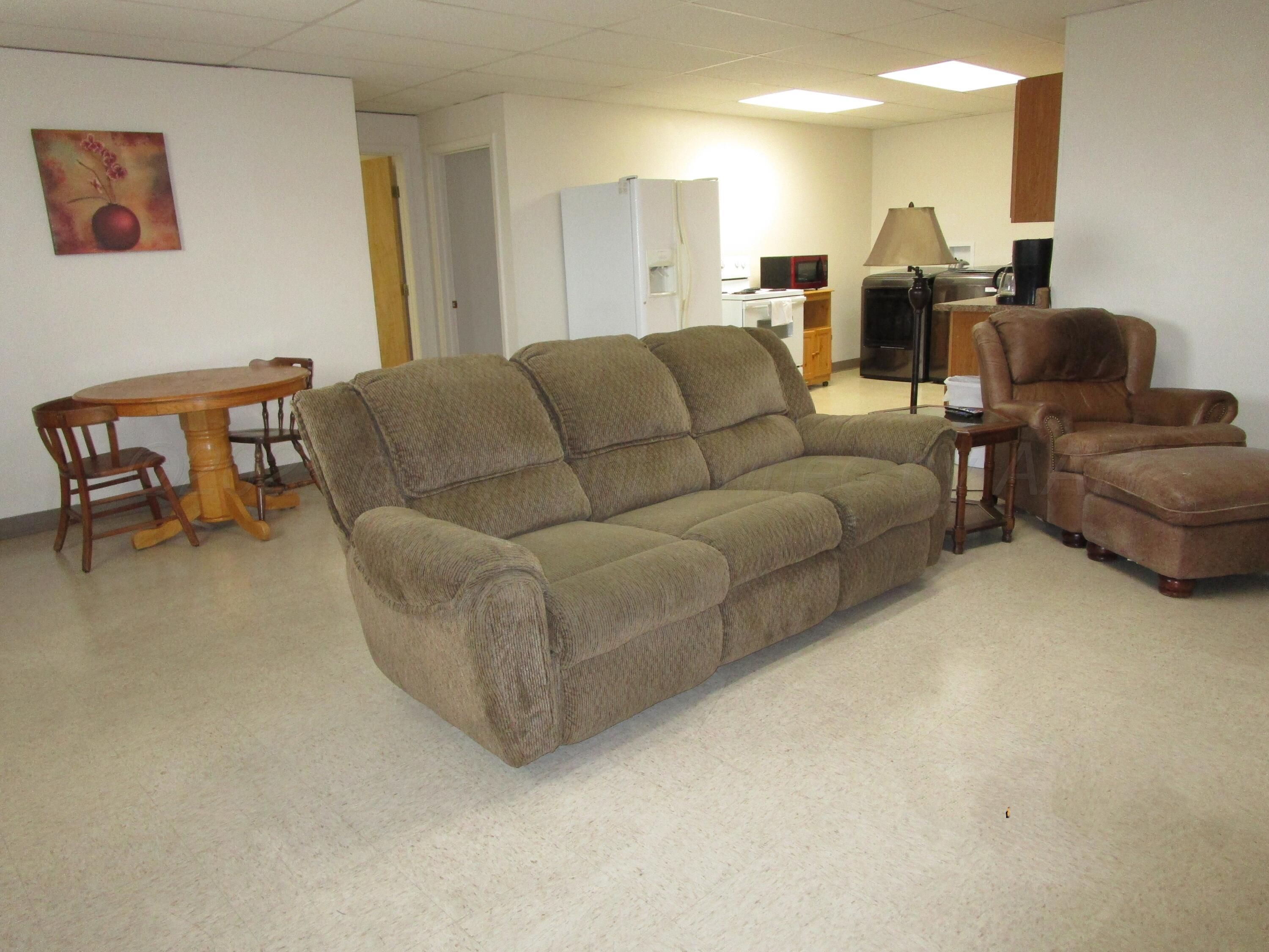 704 Deahl Street Borger, TX 79007 - Photo 2 of 9 a living room with furniture and a couch