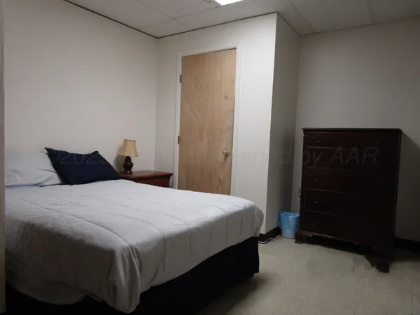 a bedroom with a bed and a closet