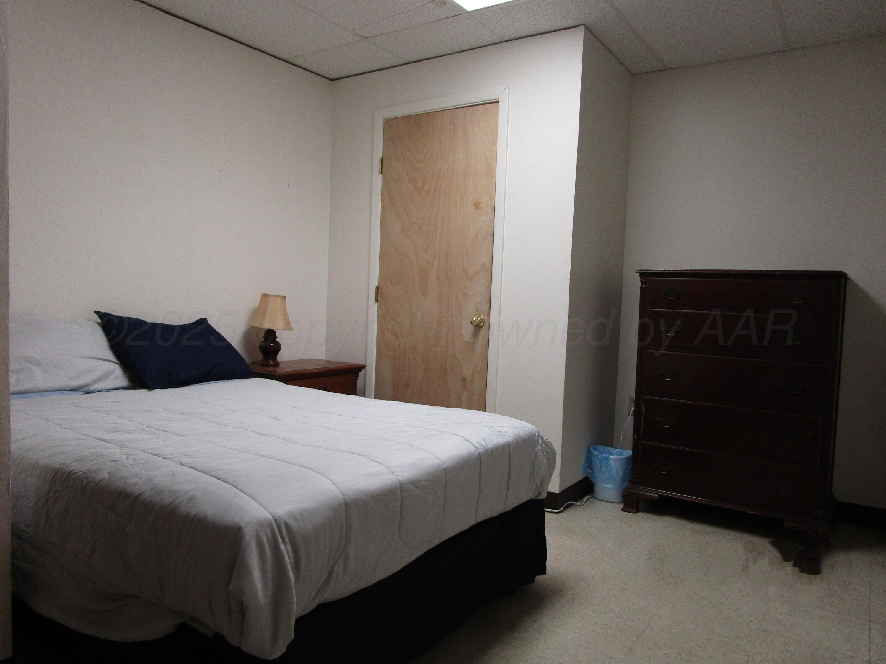 704 Deahl Street Borger, TX 79007 - Photo 6 of 9 a bedroom with a bed and a closet