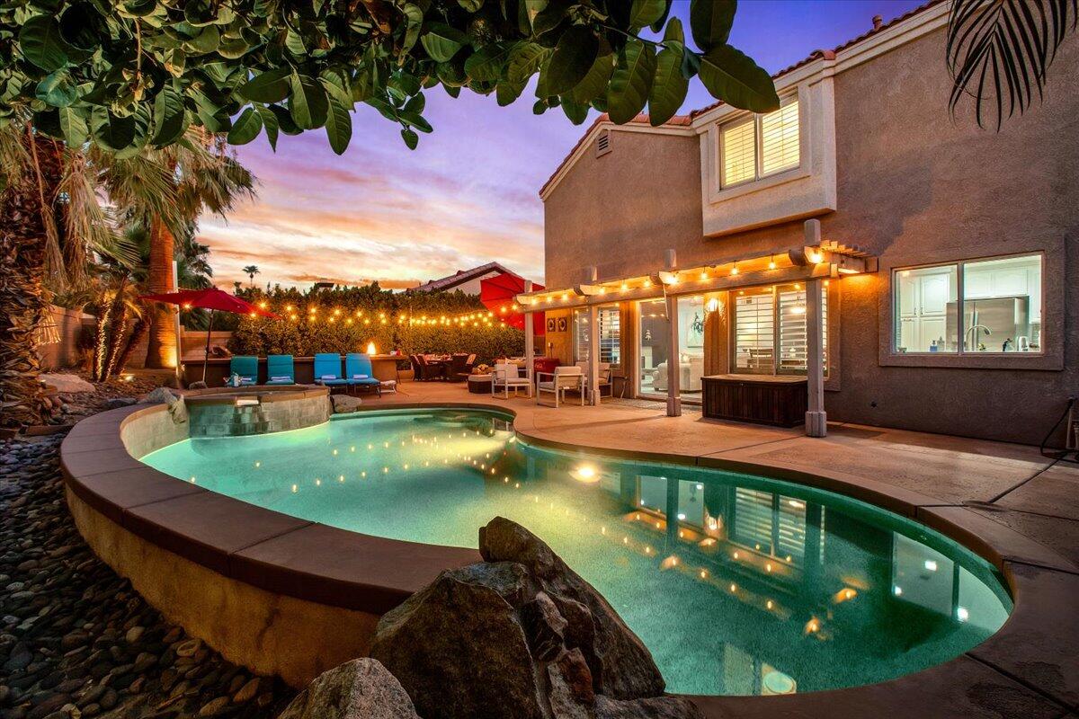 a view of a swimming pool with a patio