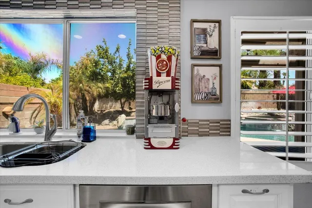 a bathroom with a double vanity sink mirror and shower