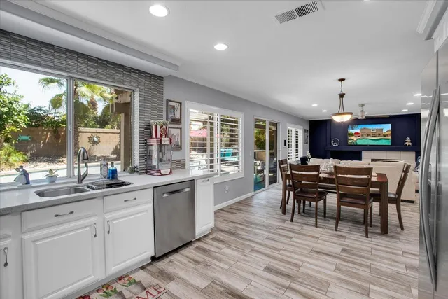 a bathroom with a shower sink and mirror