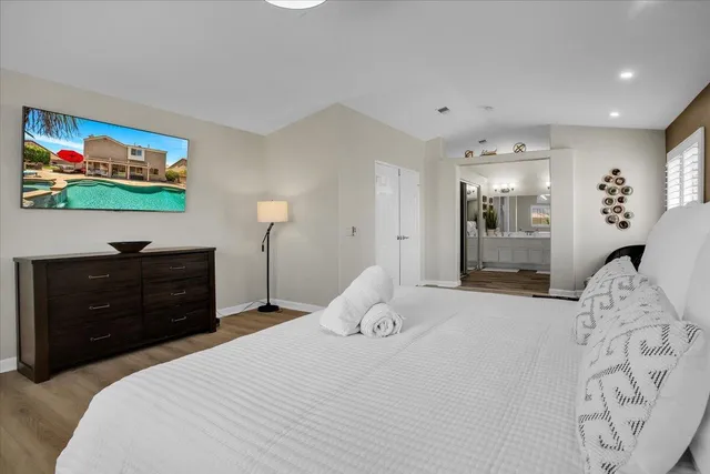 a bedroom with bed and window