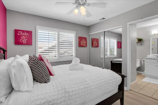 a view of a backyard with plants and swimming pool