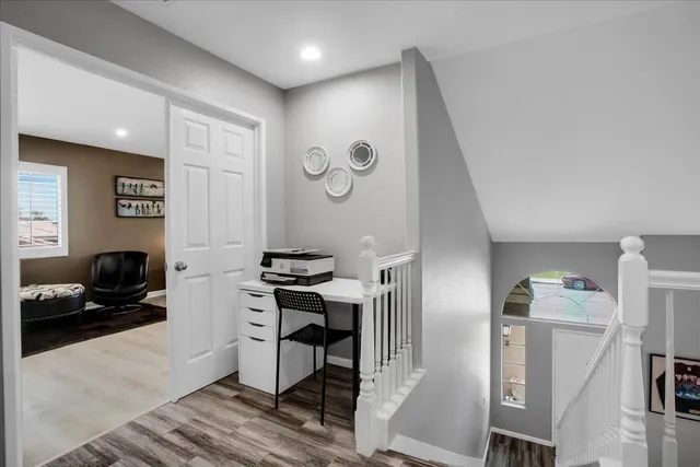 a group of chairs sitting in patio of a house