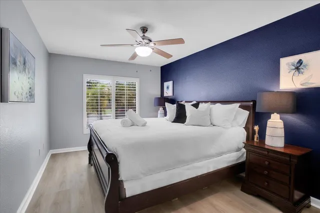 a view of a patio with couches and table under an umbrella